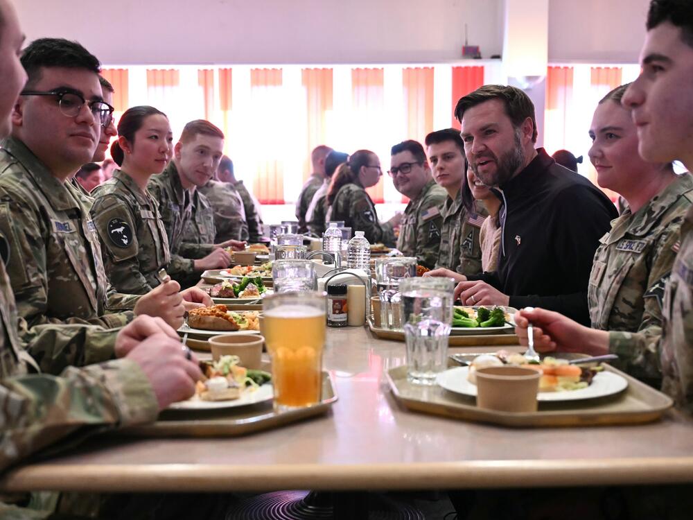 Vice President Vance (at right), seated next to second lady Usha Vance, eats at a table with service members at the U.S. military's Pituffik Space Base, in Pituffik, Greenland, on March 28.