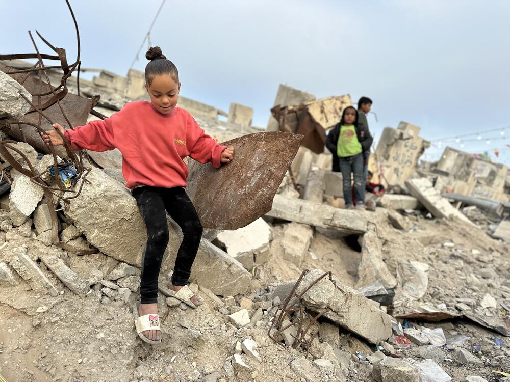 Palestinian children walk through the rubble of Gaza City, Gaza on March 6, 2025.