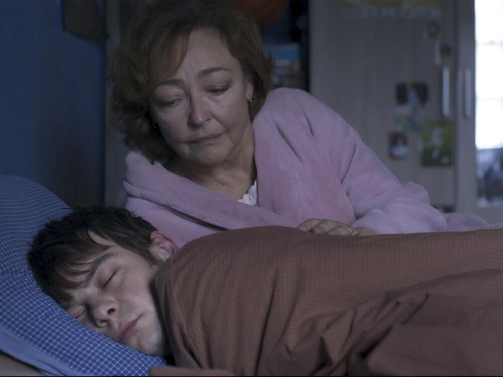 Jérémie (Félix Kysyl) stays with the newly widowed Martine (Catherine Frot) in the French thriller <em>Misericordia</em>.
