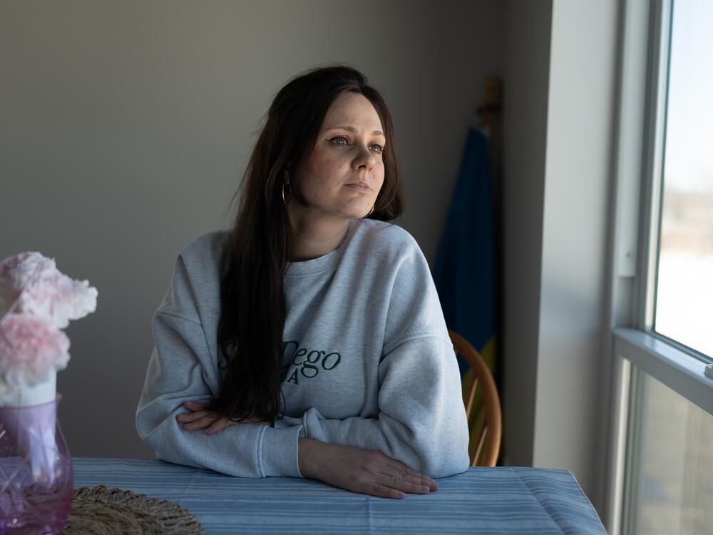 Iryna Koshun, 38, poses for a portrait at her apartment in Edina, MN, March 8, 2025. Koshun and her two children were sponsored to the US through the Uniting for Ukraine parole program, while Koshun's husband is fighting on the frontlines in the Ukrainian military.