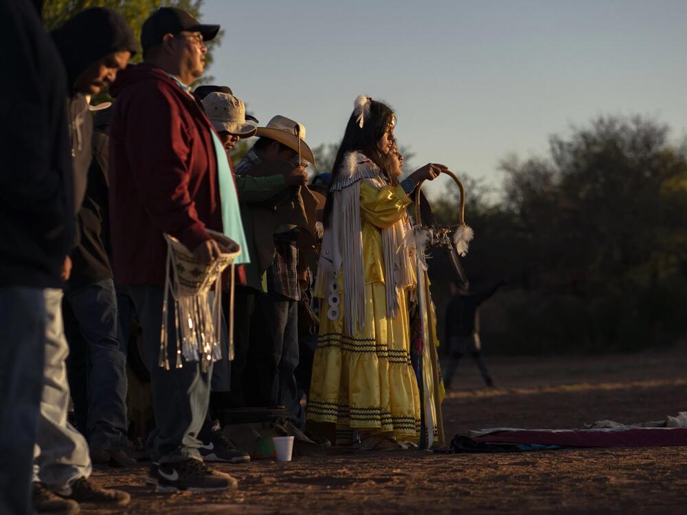 Lillian Begay and singers welcome the sunrise during her Apache Sunrise Dance.