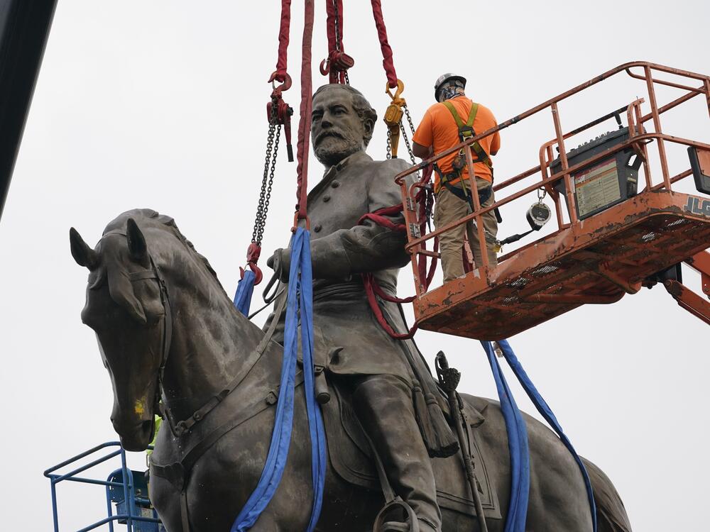 A towering statue of Confederate General Robert E. Lee is removed in Richmond, Va., in September 2021. It was one of many monuments and statues to Confederate leaders removed or relocated following protests after George Floyd's murder in 2020.