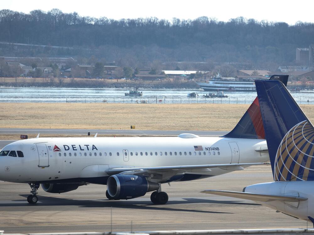 A Delta Air Lines plane taxis to its gate at Ronald Reagan Washington National Airport after landing on Jan. 30 in Arlington, Va.