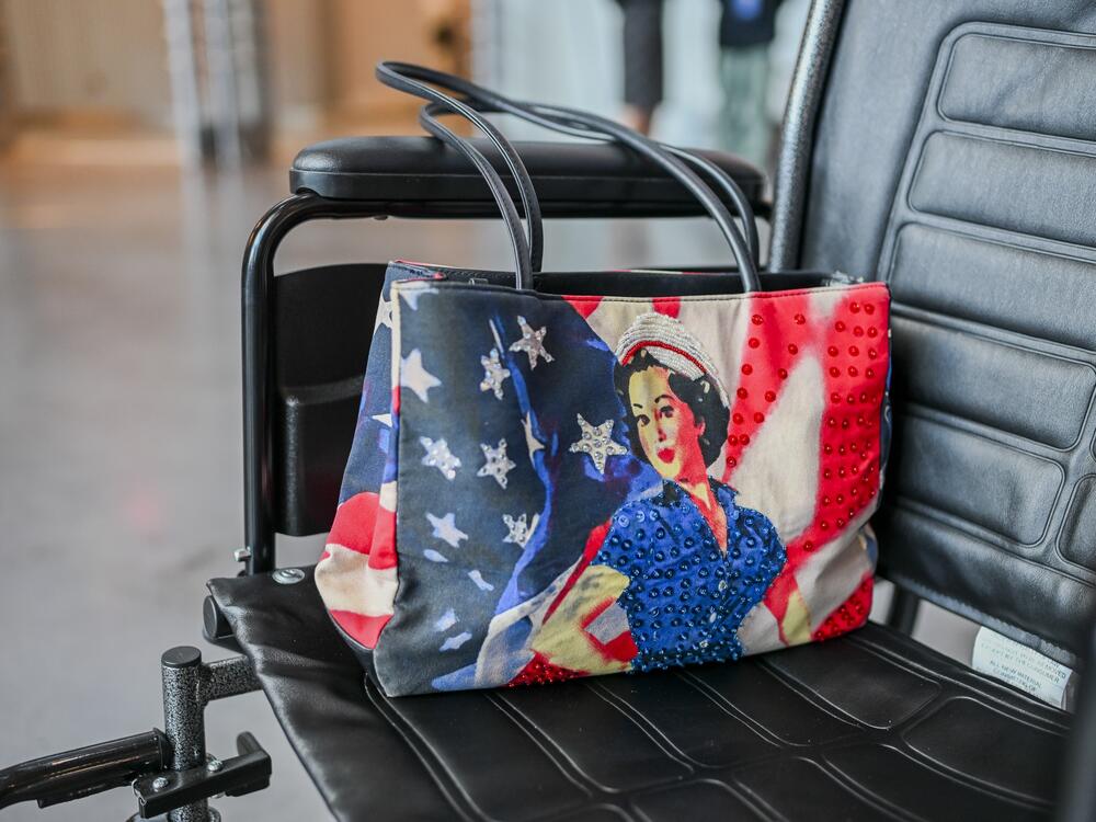 Jane Tucker proudly carries a Rosie the Riveter purse.  She works with the the American Rosie the Riveter Association to preserve the stories of women workers during WWII, and how they changed the labor landscape.