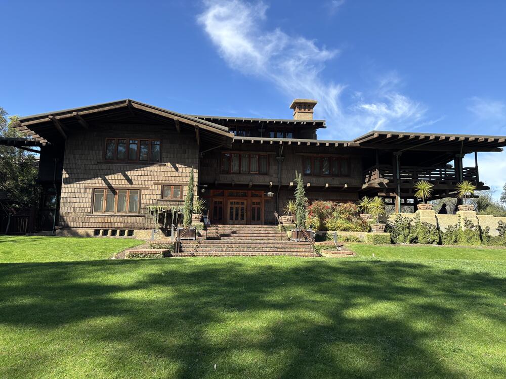 The Gamble House in Pasadena, a National Historic Landmark, was in a fire evacuation zone in the Los Angeles Fires. Its custodians are now making complex decisions about how to safeguard its future against the impacts of human-caused climate change while at the same time maintaining the historic details and atmosphere for which it is admired.
