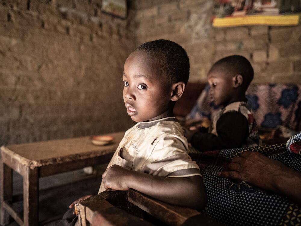 Ethan Kaunda, 4, looks out of the doorway of his home in the lead-contaminated neighborhood of Magandanyama in Kabwe, Zambia. Ethan suffers from lead poisoning that has left him with cognitive impairment and other health problems.