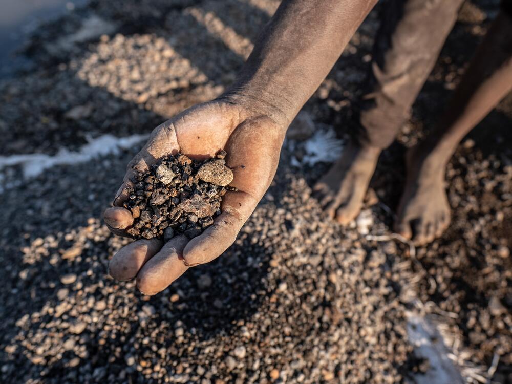 A young independent miner displays pieces of lead mined from the site of a former industrial lead mine in the town of Kabwe, Zambia. Lead levels in the blood of children surveyed in the area averaged nearly ten times higher than the CDC's benchmark for what constitutes abnormal levels.