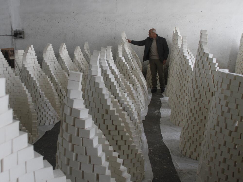 Ahmad Dwikat, a Palestinian worker, inspects bars of soap stacked to dry before packing them at a soap factory in the West Bank city of Nablus, on March 1.