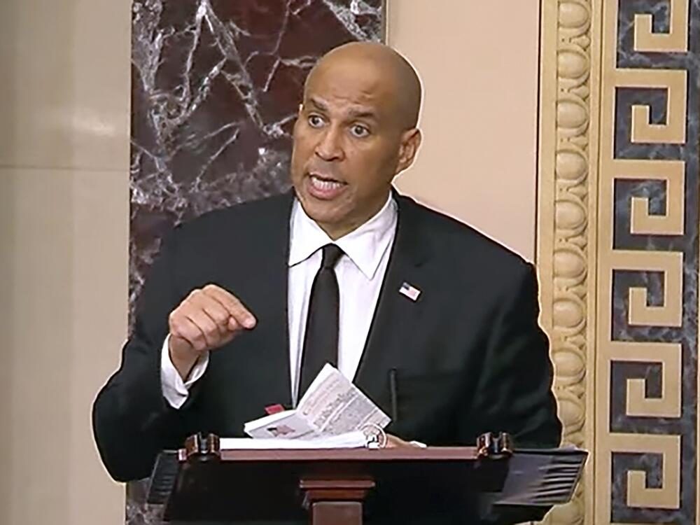 Sen. Cory Booker speaks on the Senate floor on Tuesday morning. He took the podium at 7 p.m. Monday night and promised to stay there as long as physically possible.
