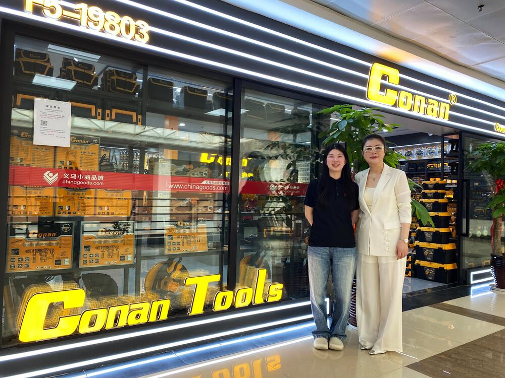 Wang Xiao Nan, left, stands with her mother, Wang Nan, who owns a wholesale hardware shop in one of the market's buildings.
