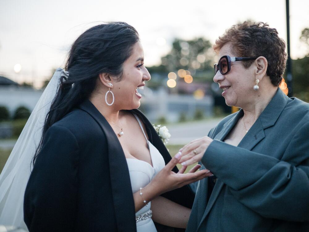 It took years for Carla Velastegui to see herself as her mom Gina's caregiver. For many years, she thought of helping her simply as what family does for each other.  Here they celebrate together at Carla's wedding.