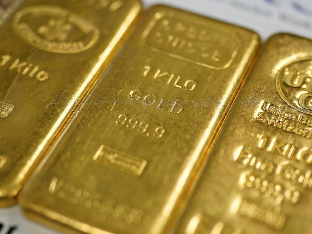 Gold prices have been hitting record highs. Pictured are gold bullion bars in Birmingham, England on Dec. 13, 2023.
