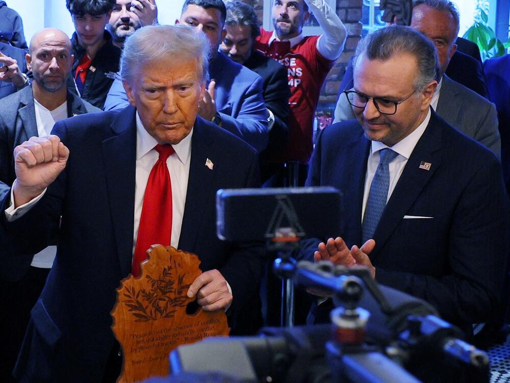 Republican presidential nominee and former U.S. President Donald Trump is joined by Massad Boulos, who was recently named as a 'senior advisor to the President on Arab and Middle Eastern Affairs,' during a campaign stop at the Great Commoner restaurant in Dearborn, Michigan, U.S., on November 1, 2024.