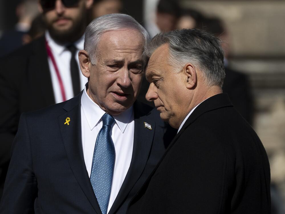 Israeli Prime Minister Benjamin Netanyahu, left, and Hungarian Prime Minister Viktor Orban, right, talk after a welcoming ceremony with a guard of honor at Buda Castle in Budapest, Hungary, on Thursday.