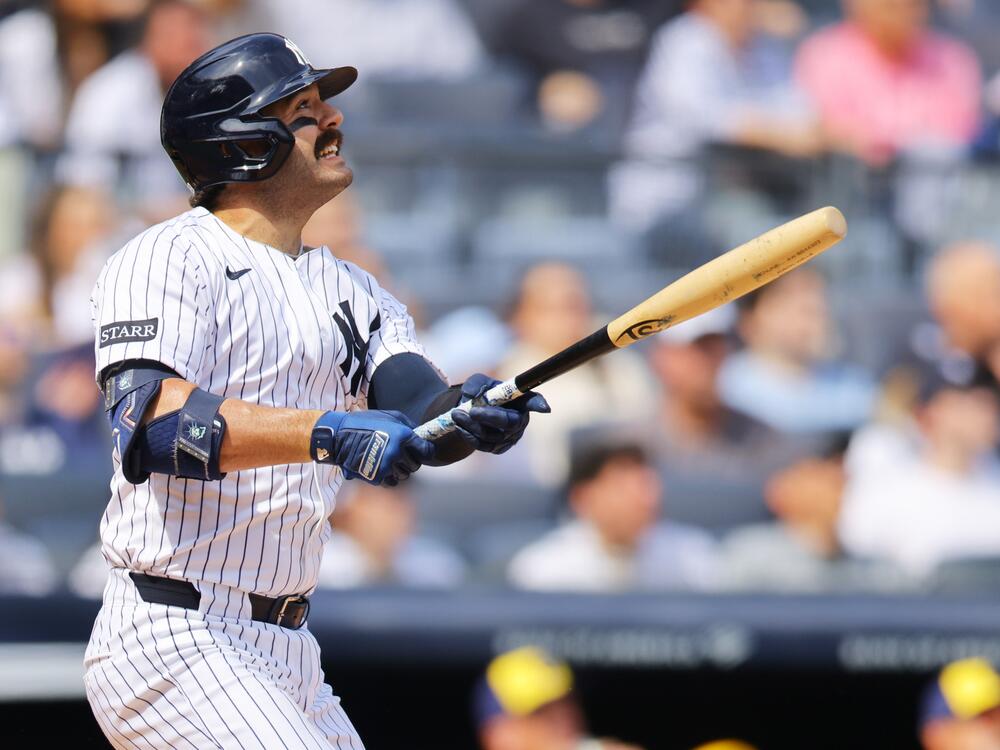 The New York Yankees' Austin Wells hits a home run using a torpedo bat against the Milwaukee Brewers at Yankee Stadium on Saturday. The bats' distinctive shape quickly became the talk of the new baseball season.