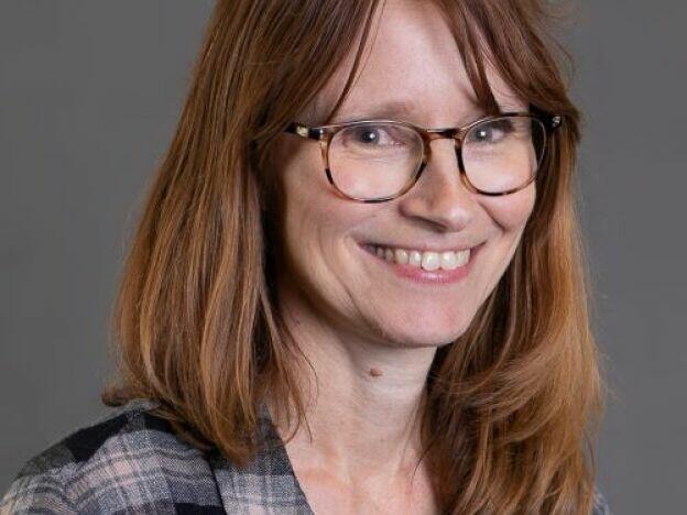 Michigan librarian Dawn Woodward is cutting back on spending. But she did buy a new television weeks early for her son's birthday, in order to avoid a threatened tariff.