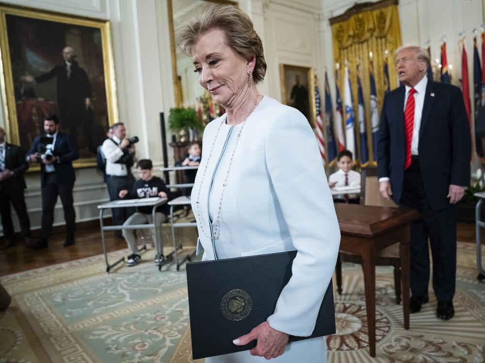 Secretary of Education Linda McMahon and President Donald Trump depart after the president signed an executive order, on March 20, aimed at closing the Education Department.