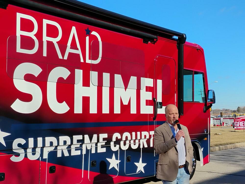 Waukesha County Judge Brad Schimel speaks to supporters in Waukesha, Wis., before boarding his campaign bus on March 22.
