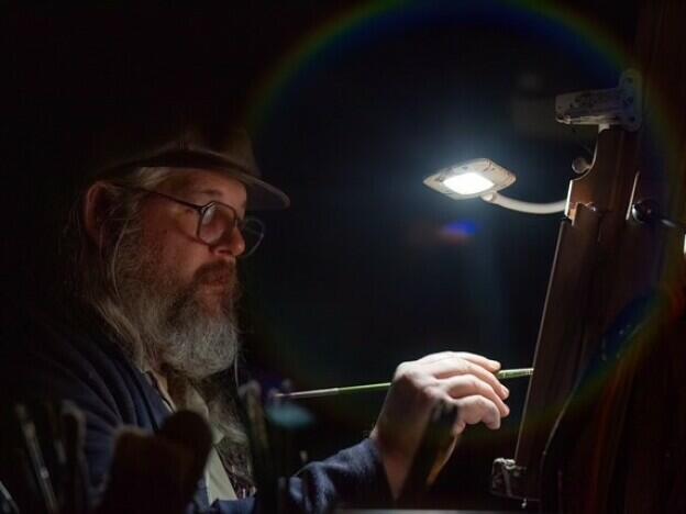 In March 2025, the University of South Alabama presented its Annual Songwriter Keynote, a conversation and concert event funded, in part, by a grant from the Alabama Humanities Alliance. Gulf Coast artist Robby Amonett, pictured above, live-painted the event.