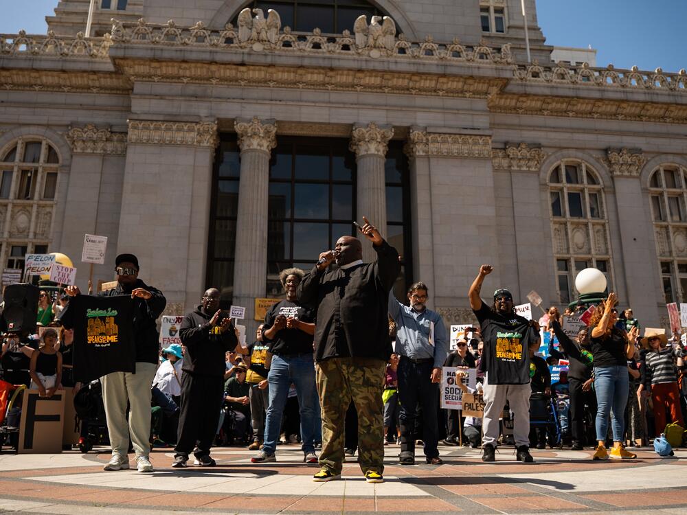Pastor Michael McBride leads a chant during a Hands Off! rally in Frank Ogawa Plaza on April 5, 2025.