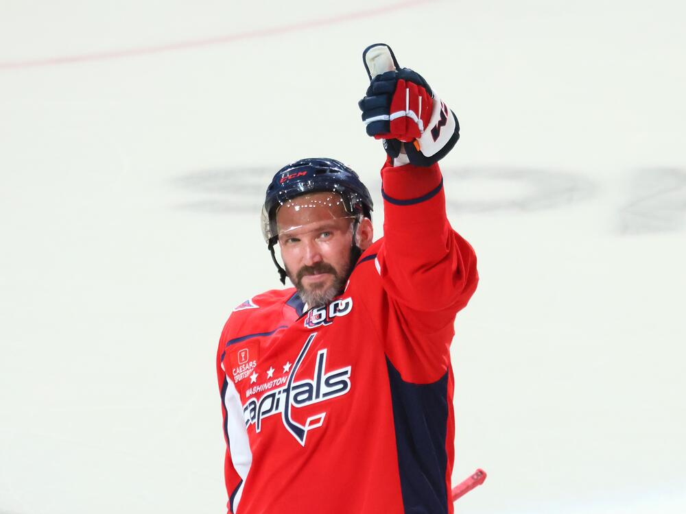 Alex Ovechkin of the Washington Capitals celebrates after defeating the Chicago Blackhawks and scoring his 894th career goal at Capital One Arena on Friday in Washington, DC. Ovechkin's goal ties him with Wayne Gretzky for the all-time goal scoring record.