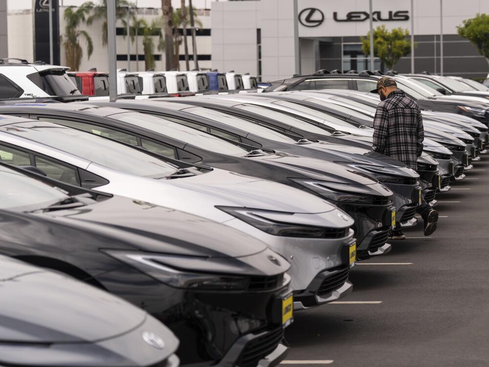 A person looks at a new vehicle at a Toyota dealership in El Monte, Calif., Thursday, March 27, 2025. (AP Photo/Jae C. Hong)
