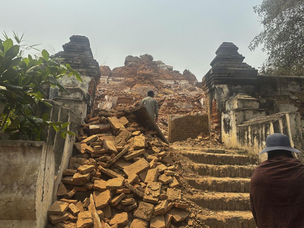 Visitors walk near damaged Maha Aungmye Bonzan Monastery, commonly known as the Me Nu Brick Monastery, in the aftermath of Friday's earthquake in Innwa, Tada-U township, Mandalay, Myanmar on Friday.