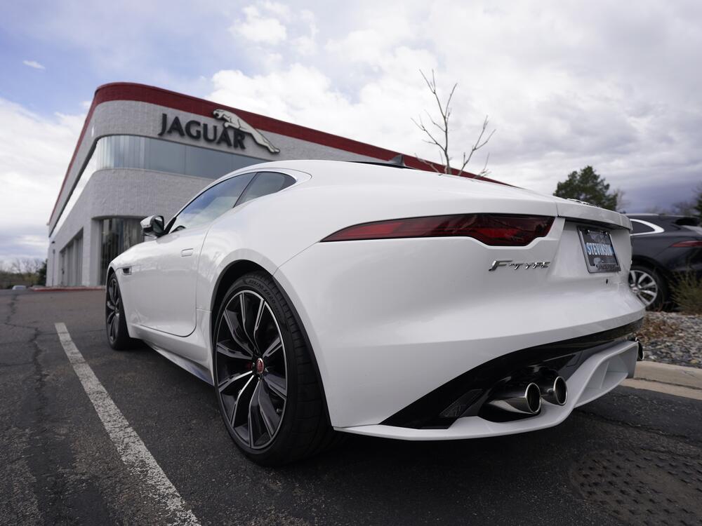 FILE - An unsold 2021 F-Type coupe sits at a Jaguar dealership in this photograph taken Sunday, May 2, 2021, in Littleton, Colo.