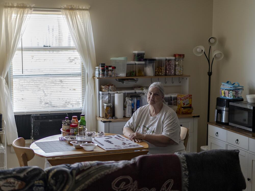 Deanna Moore in her Trinity Woods apartment March 28.  The affordable senior living center gave residents window units after their central AC system died three years ago. But last summer, Moore says, the building's community room was too hot to hold bingo nights.