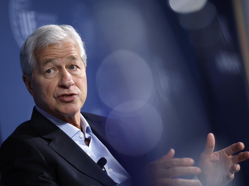 JPMorgan Chase CEO Jamie Dimon, pictured at a meeting in October, warned Monday that tariffs will raise prices, slow economic growth and hurt the country's global standing.