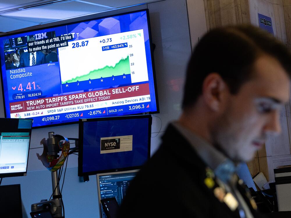 Traders work on the floor of the New York Stock Exchange on Thursday, which saw the worst markets selloff in five years.