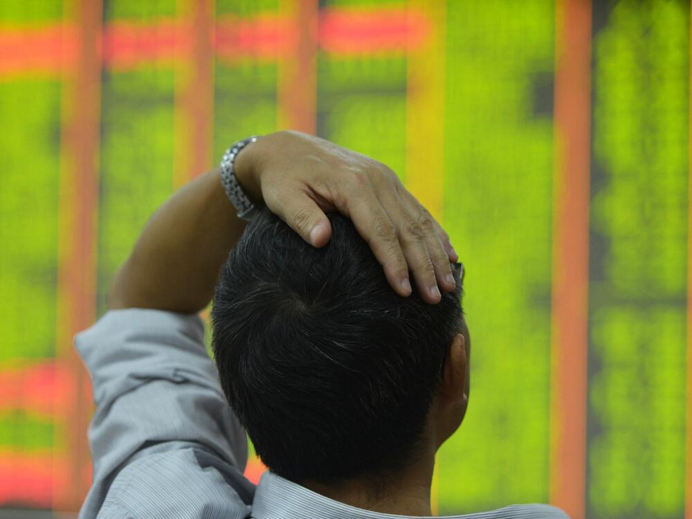An investor monitors share prices at a securities trading office on Monday in Hangzhou, China.<br><br>
