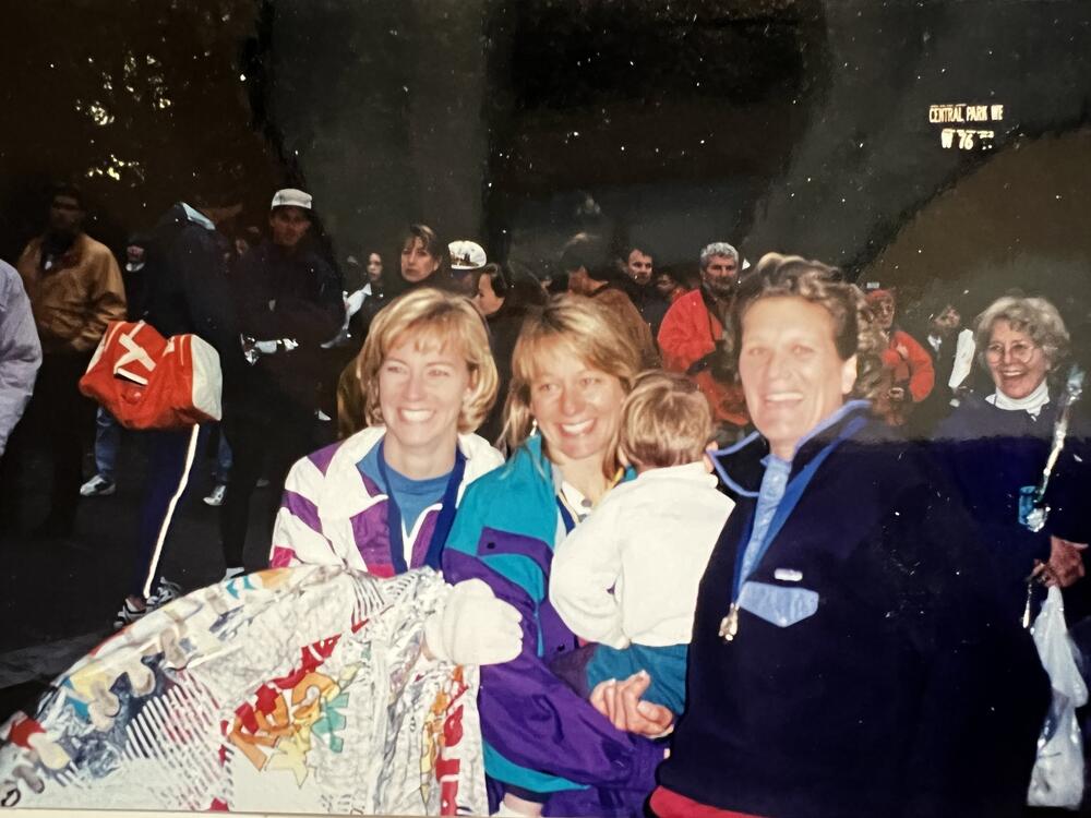 Nancy Willis (in the middle) with two friends, Susan Reedy and Laney Price, who ran the marathon with her, taken at the end of the race before Jack went missing. Willis is holding her son Peter.