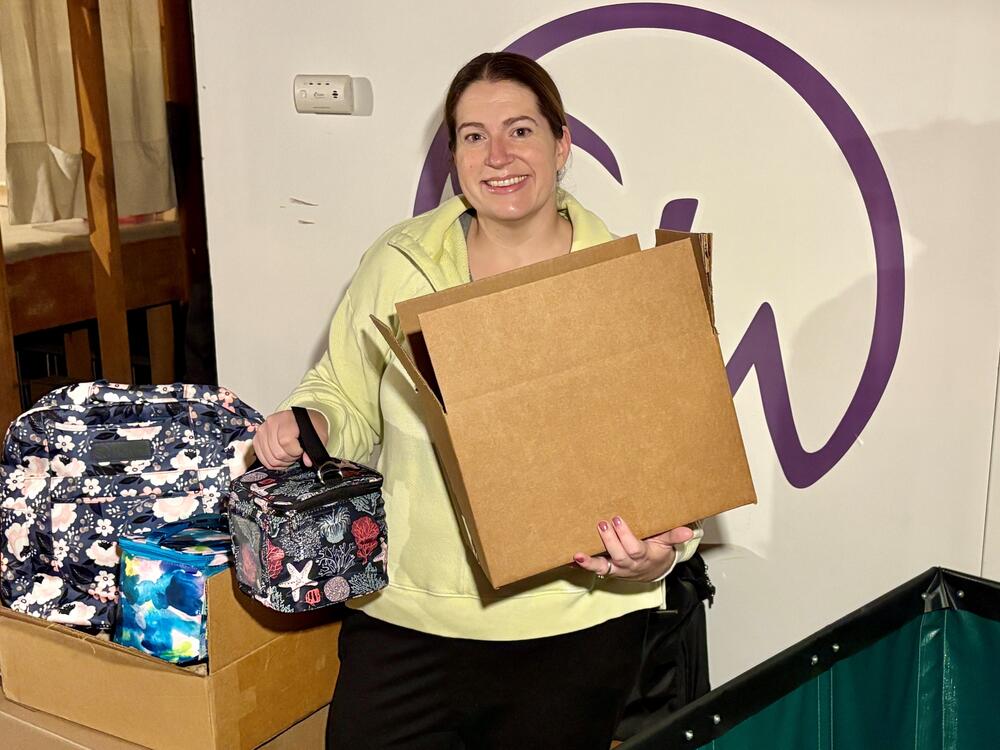 Sarah Wells packs and prepares to ship some of her bags and accessories for new moms.