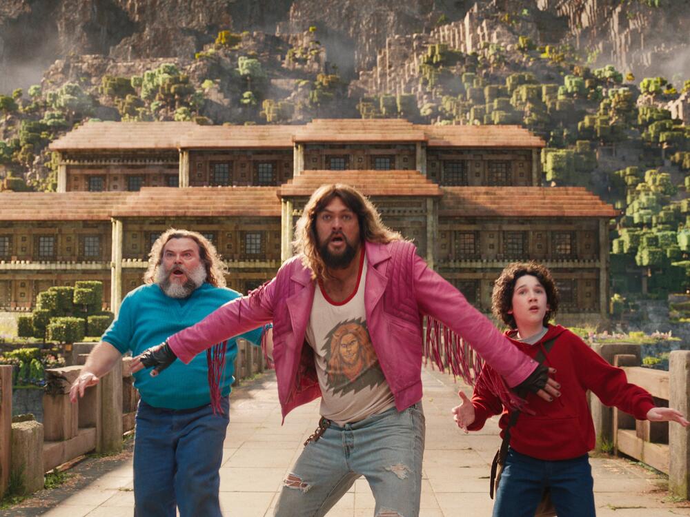 from L to R: Jack Black, Jason Momoa and Sebastian Eugene Hansen star in <em>A Minecraft Movie</em>