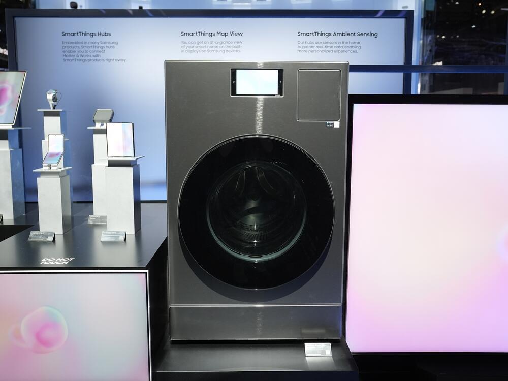 The Samsung Bespoke AI Washing Machine is displayed at a Samsung booth during the CES tech show on Jan. 8 in Las Vegas. Samsung is among many appliance manufacturers adding AI to products.
