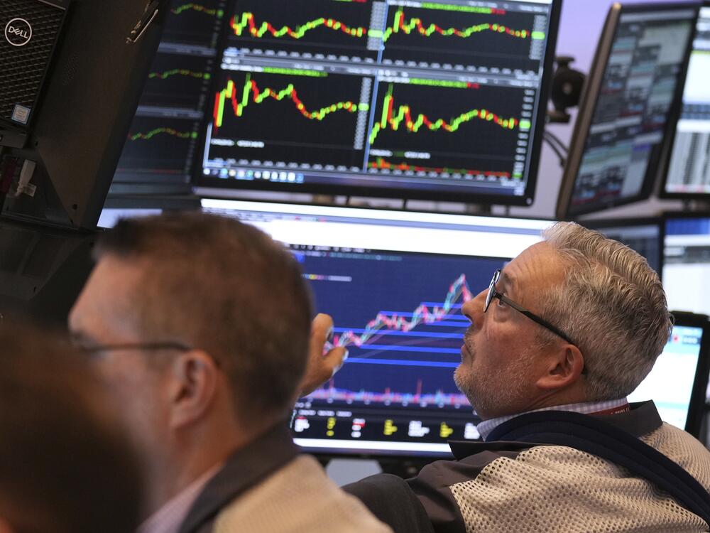 Traders work on the floor Monday at the New York Stock Exchange in New York.