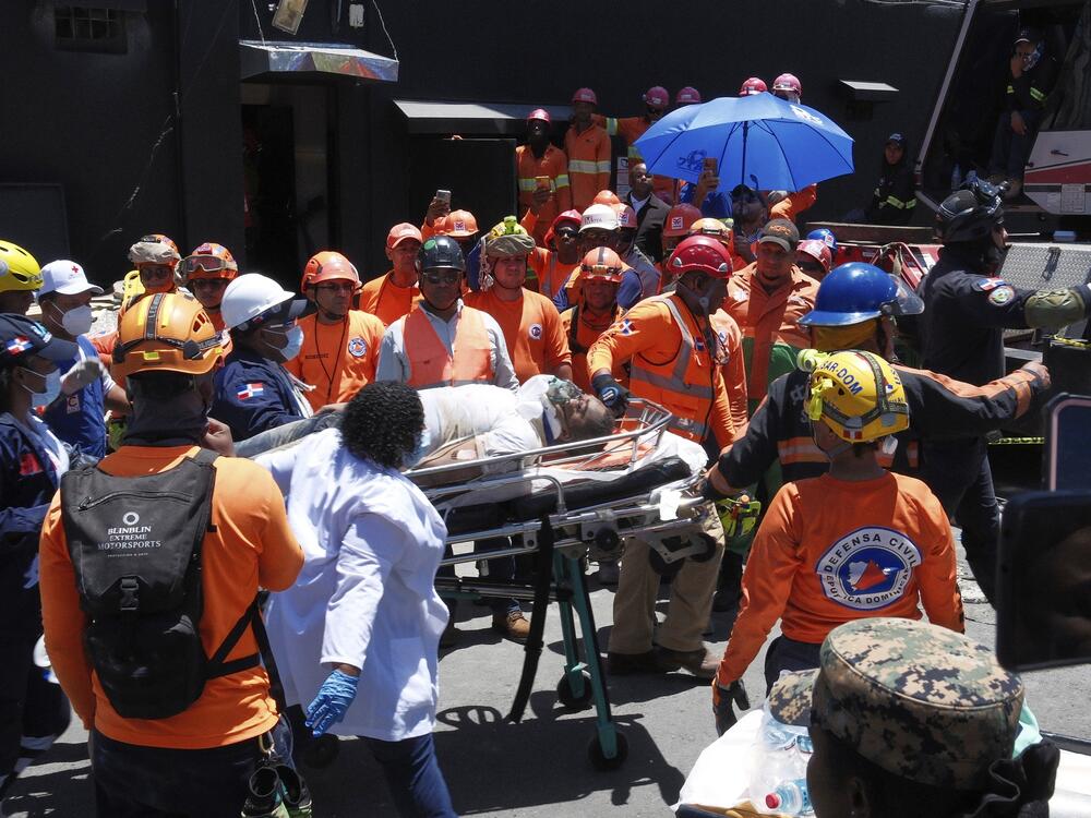 Rescue workers carry a person pulled from the wreckage of the Jet Set nightclub after its roof collapsed during a merengue concert in Santo Domingo, Dominican Republic, Tuesday, April 8, 2025.