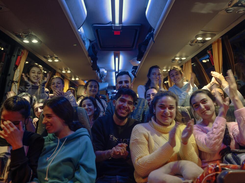 Evacuated Druze students celebrated their evacuation to safety on buses after Alawites were targeted in revenge attacks by Sunni Arab militants, March 10.
