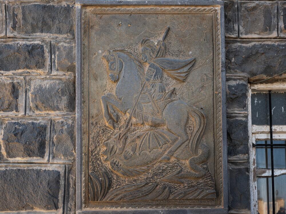 Outside Hijri's reception hall, a stone plaque depicts St. George slaying a dragon. The Druze widely believe St. George to be a reincarnation of St. John the Baptist.
