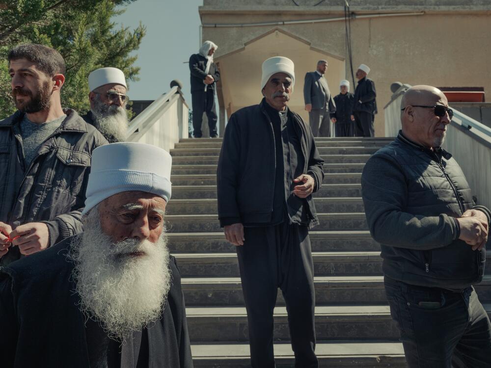 Supporters of Sheikh Hikmat al-Hijri, the Druze spiritual leader, are welcomed at a reception in his village home in Sweida on March 12.