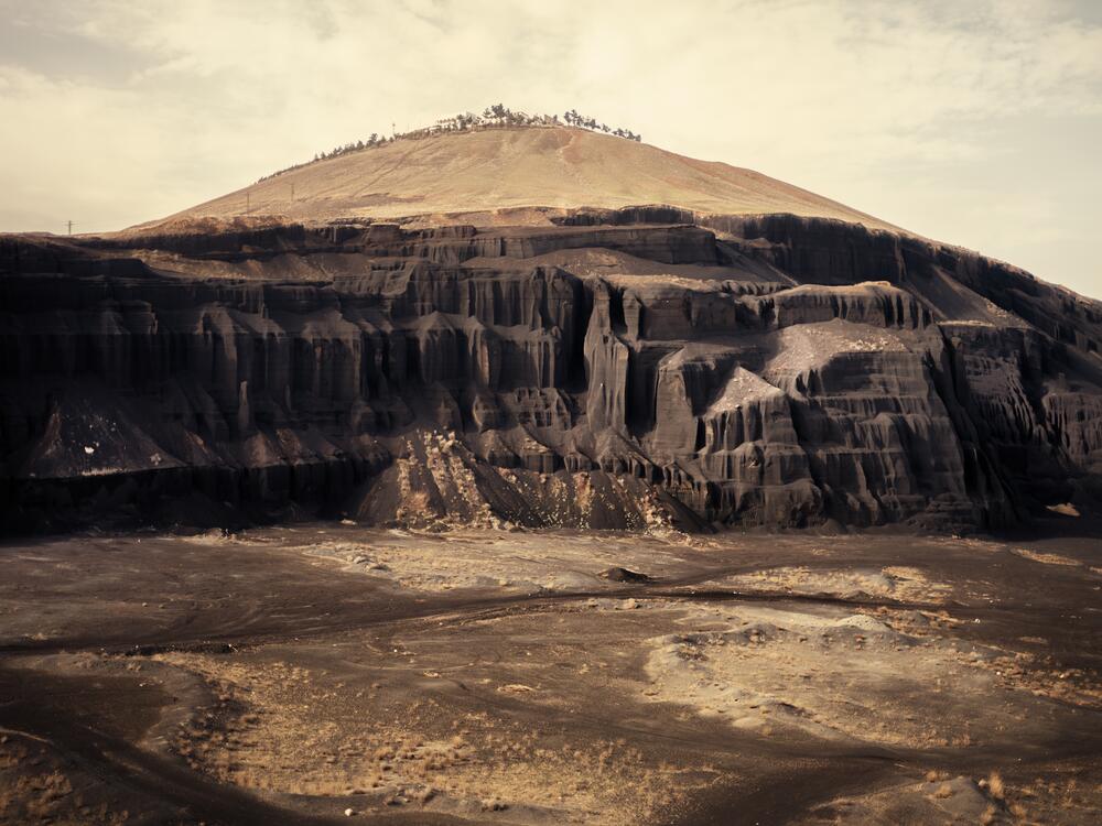 The road from Damascus to Sweida winds through outcrops of black volcanic rock.