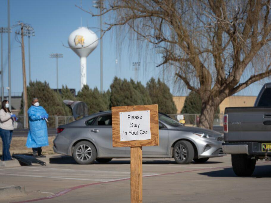 Signs point the way to measles testing in the parking lot of the Seminole Hospital District across from Wigwam Stadium on February 27, 2025 in Seminole, Texas.