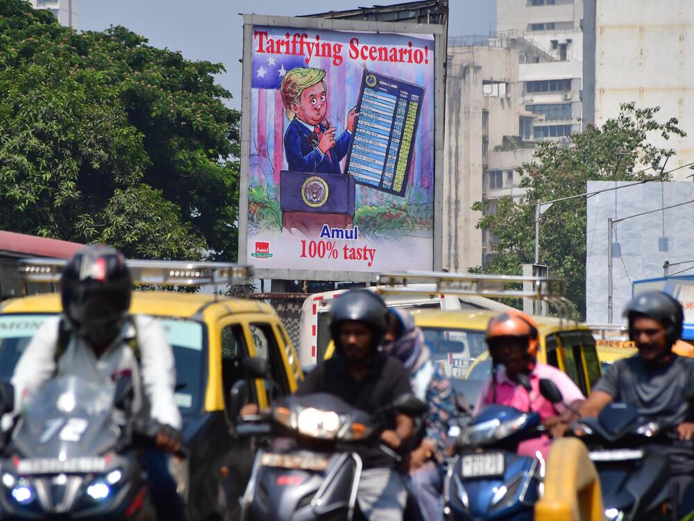 A billboard ad in Mumbai, India, provides commentary on President Trump's tariffs.