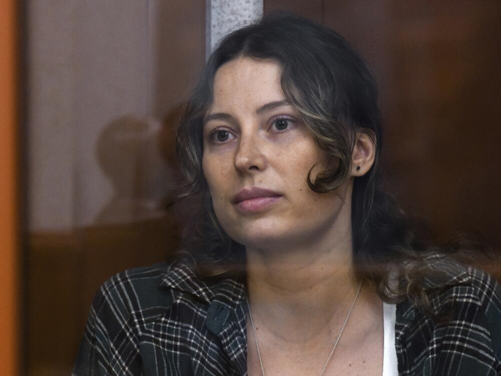 Ksenia Karelina, also known as Khavana sits in a glass cage in a court room in Yekaterinburg, Russia, Thursday, June 20, 2024.
