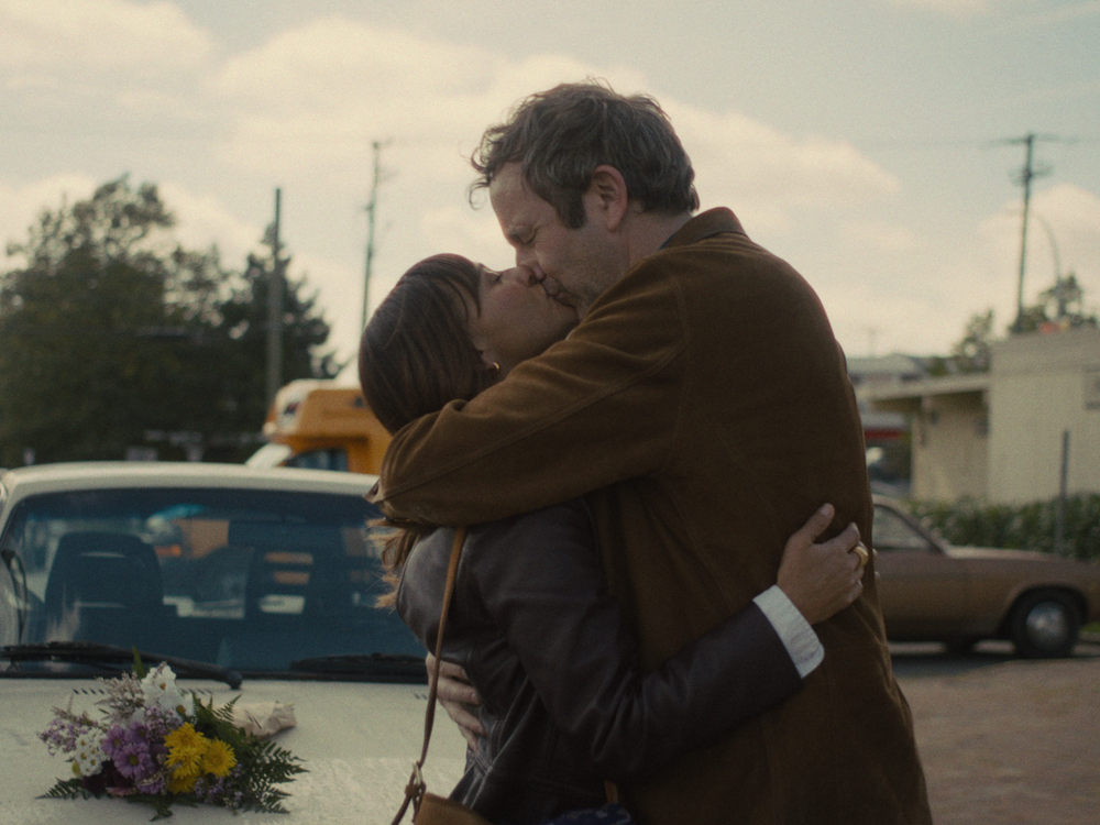 Actors Rashida Jones and Chris O'Dowd embrace in 