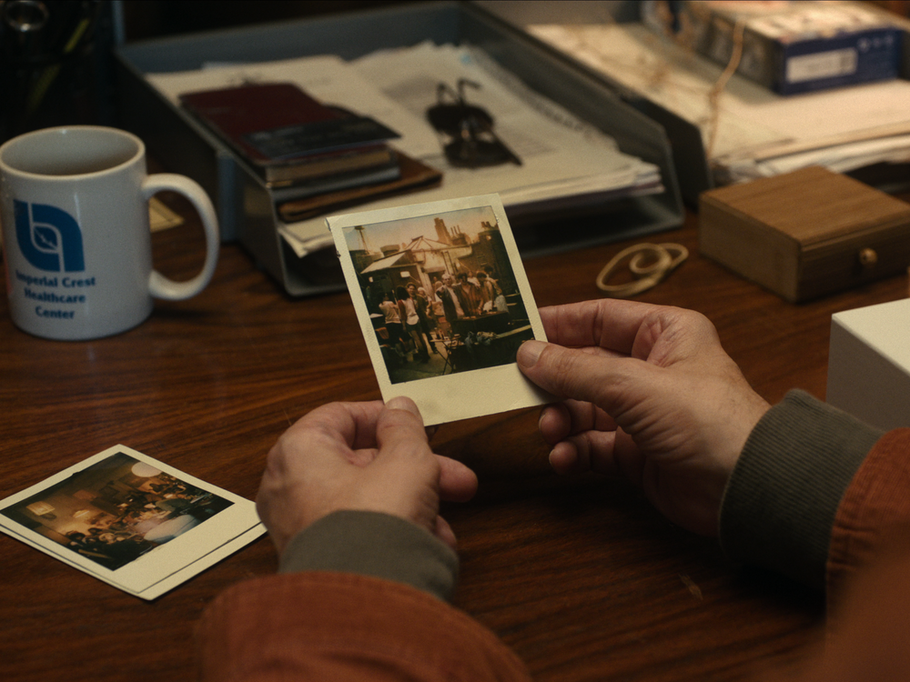 Actor Paul Giamatti plays a man who, using AI, steps back into old photographs from a romantic relationship in 