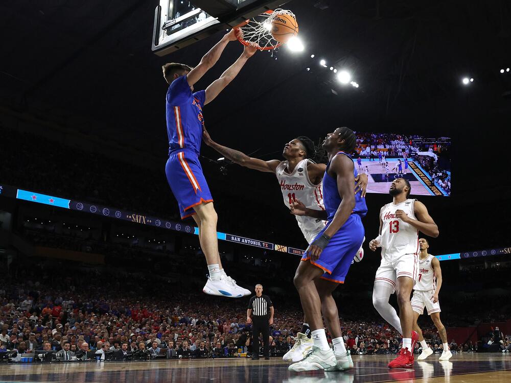 Alex Condon #21 of the Florida Gators dunks the ball against Joseph Tugler #11 of the Houston Cougars during the second half in the National Championship of the NCAA Men's Basketball Tournament at the Alamodome on Monday in San Antonio, Texas. Florida defeated Houston to win its third title.