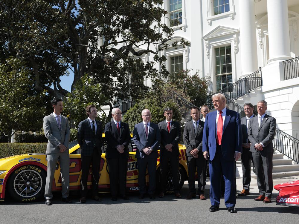 President Trump talks to reporters about his tariff decision during an event with race car drivers and owners at the White House on April 9.