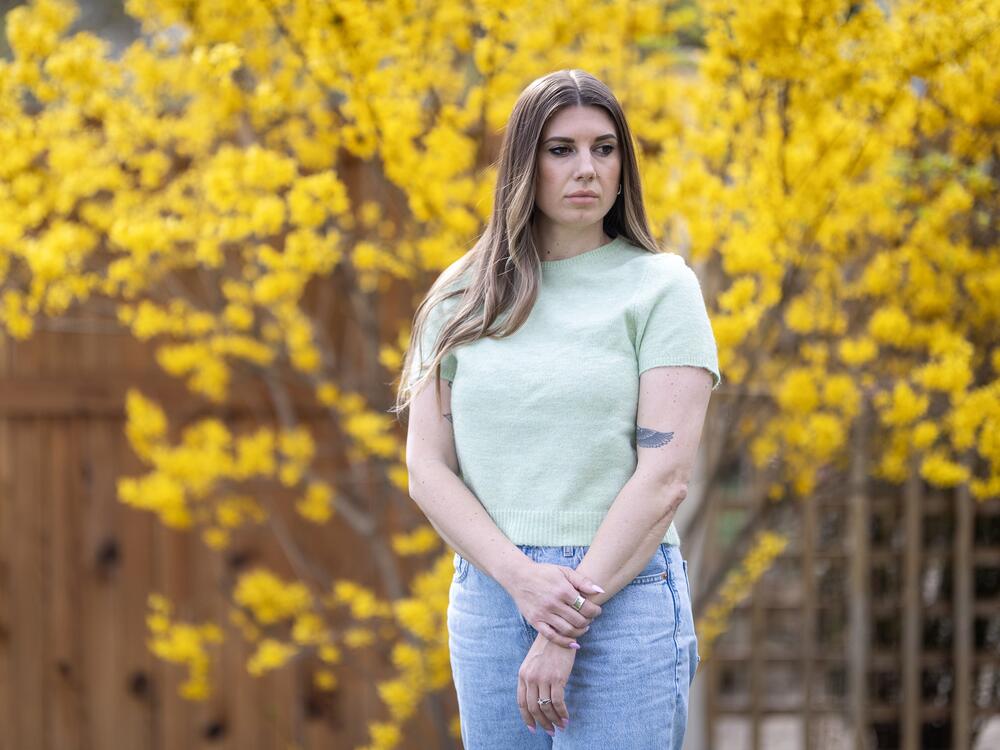 Sarah Inama still teaches her world civilization class and the poster she was ordered to take down last month is still hanging in her classroom, but she's demoralized by the incident.